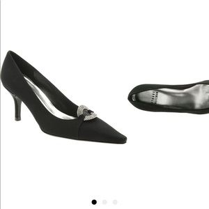 Designer Stewart Weizman “donut” black pumps.